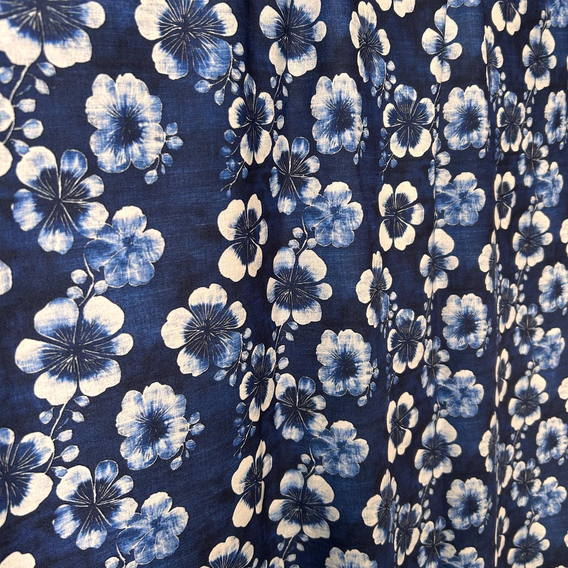 Nishigori fabric. indigo dyeing, shibori-dyed blue Tung flower pattern. fabric by yard.